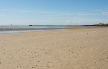 Fototapeta na wymiar Deserted sandy beach at Littlehampton, Sussex, England