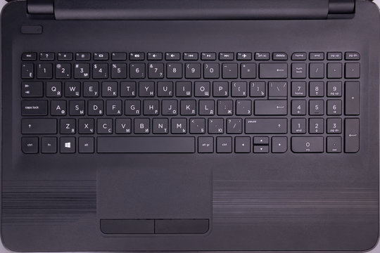 Black keyboard on the whole screen. Letters and figures close-up. - Powered by Adobe
