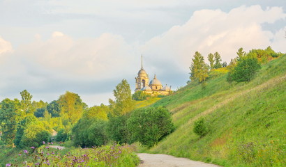 Fototapeta na wymiar The Church of Saints Boris and Gleb on the hill in Staritsa