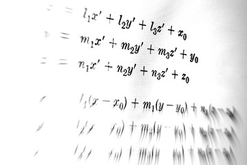 Large number of mathematical formulas focus on a white background