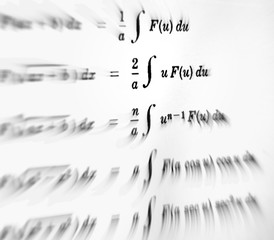 Large number of mathematical formulas focus on a white background
