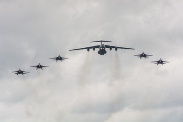Aerobatic team consisting of five fighters and one transport aircraft