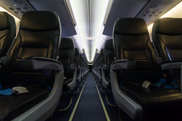 Passenger seats, Interior of airplane with the aisle and empty seats. Travel concept.