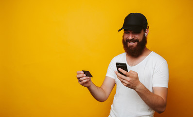 Man paying with credit card on smart phone