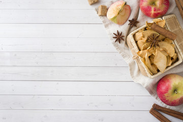 Apples are fresh and dry with spices. Cinnamon sticks, star star anise star and cloves. Copy space