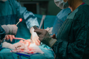 Hysterectomy surgery.General view during surgery, blurred background.