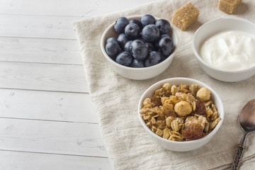 Oat flakes, granules and nuts muesli with blueberries. The concept of healthy food, Breakfast.