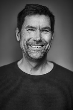 Portrait of smiling man, black and white