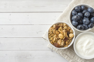 Oat flakes, granules and nuts muesli with blueberries. The concept of healthy food, Breakfast.