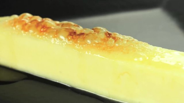 Gratin traditional Brazilian curd cheese called queijo coalho  with honey