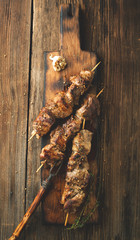 Grilled meat on skewers. BBQ meat with spices. © Belokoni Dmitri