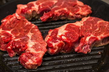 Three Chuch Steaks Grilling