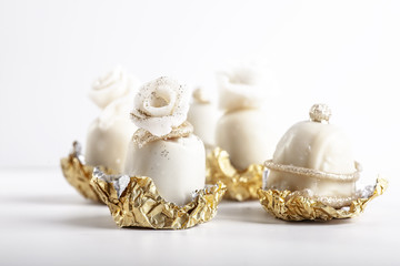 Marzipan sweets on white background