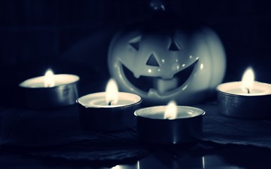 Black and white colors of Halloween pumpkin face decoration closeup blur background