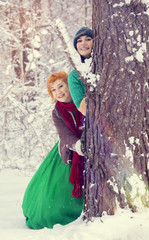 young couple, man and woman, husband and wife are walking in costumes of flowers typical of the...