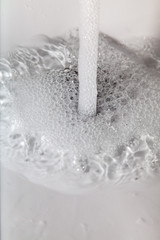 Water running. Waste of drinking water with the tap open