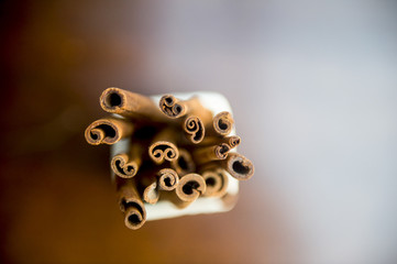 Cinnamon sticks on wooden blur background