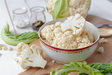 Organic cauliflower on wooden background
