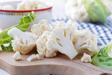 Organic cauliflower on wooden background