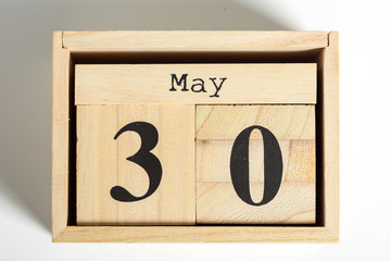 Wooden cubes with date on white background. 30th of May