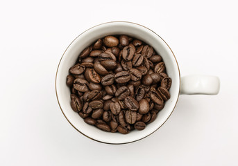 black coffee beans in a white Cup