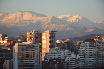 landscape of mountain snow and cityscape