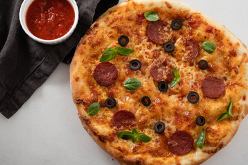 Pepperoni pizza on a white background. Copy space.