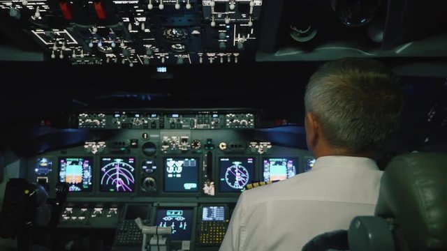 Captain is controls the airplane, rear view.