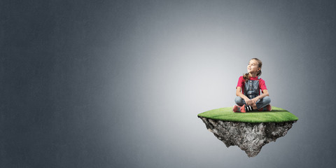 Concept of careless happy childhood with girl on flying island