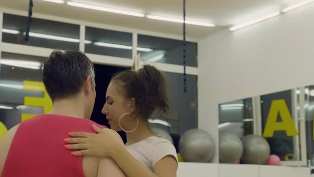 Man and woman dacing bachata. Close up portrait shot. Slow motion footage