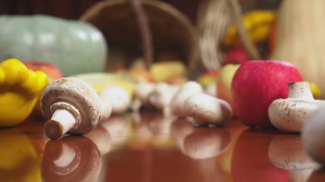 Autumnal Harvest or Thanksgiving, Cornucopia filled with vegetables, vegetables spilled out of the basket on the table. 4k, dolly shot