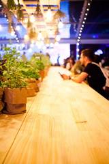 people sitting at a bar - focus on table