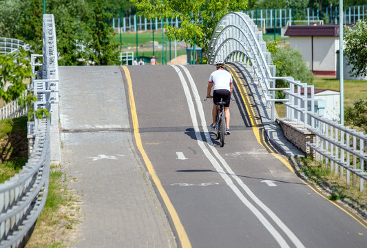 Cyclist ride on the bike path in the city Park 