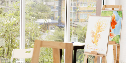 Art room in relax time and raining drop near window. Fish painting in iving room.