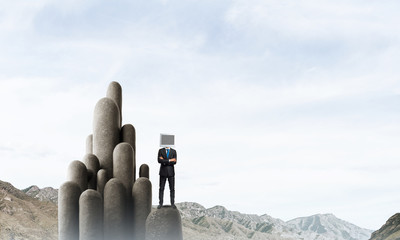 Businessman with monitor instead of head.