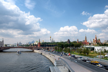 A view of the Moscow Kremlin, the river and the embankment from the floating bridge of the Zaryadie Park. Moscow, Russia