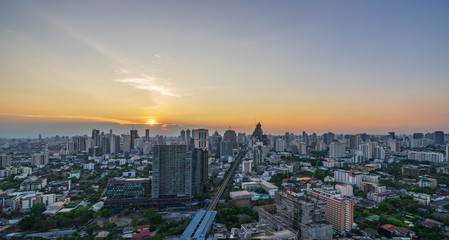 Naklejka na ściany i meble sunset skyline cityscape of metropolis