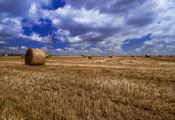 Plakat of hay bales and clouds 