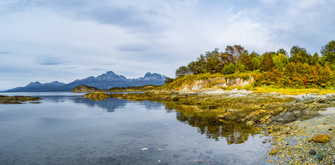 Beautiful landscape of lenga forest, mountains and lagoon at Tierra del Fuego National Park, Patagonia