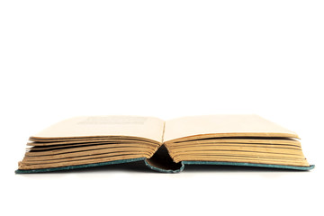 An open old book on a white background with copy space