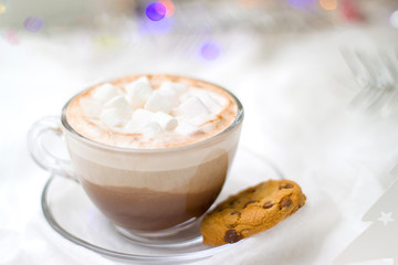 Christmas and new year card with cup of cacao hot chocolate with marshmallow and gingerbread cookies blurred lights on background - holidays, winter, celebration and good morning concept