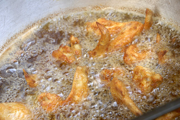 Frying Chicken in big hot oil 