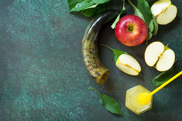 Background Rosh hashanah (Jewish New Year). Traditional holiday symbols - shofar, honey and apple...