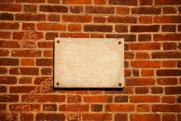 Fototapeta na wymiar plaque on a brick wall