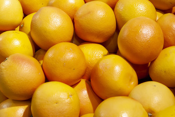 Fresh Mandarins spread out evenly in the shop window.