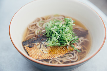 Soba noodles soup with Mackerel or Saba in Japanese on film vintage style japanese food