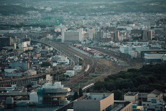 Japanese local railway and train station on cityscape in film vintage style