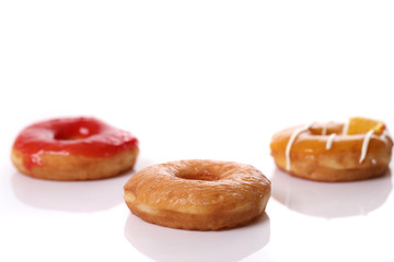 Chocolate strawberry and orange Donut isolated on white background