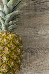 Pineapple on a wood background