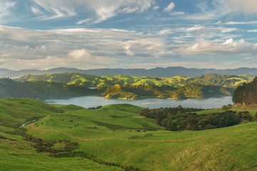 Fototapeta na wymiar View over Coromandel peninsula from state highway 25 in the winter evening after rain. Near Manaia, 15 km south of Coromandel town. New Zealand North Island